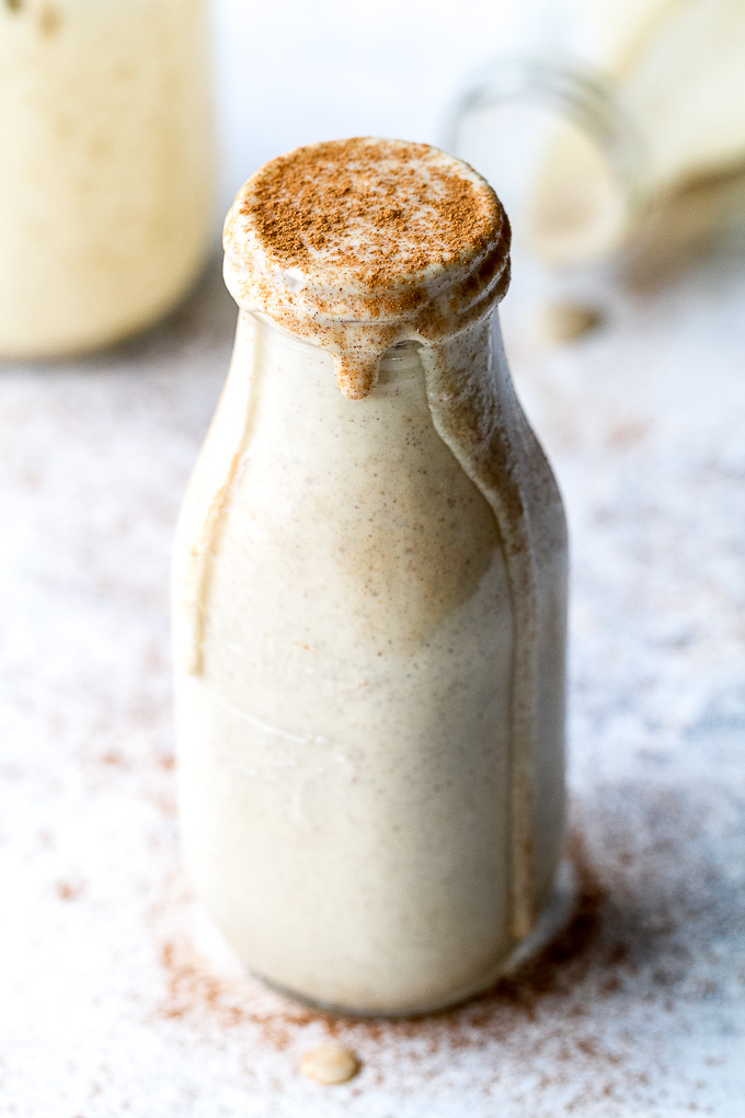 This caramel apple protein smoothie is going to become your favourite way to enjoy an apple a day! It's super creamy, packed with protein, and guaranteed to keep you satisfied all morning! | runningwithspoons.com