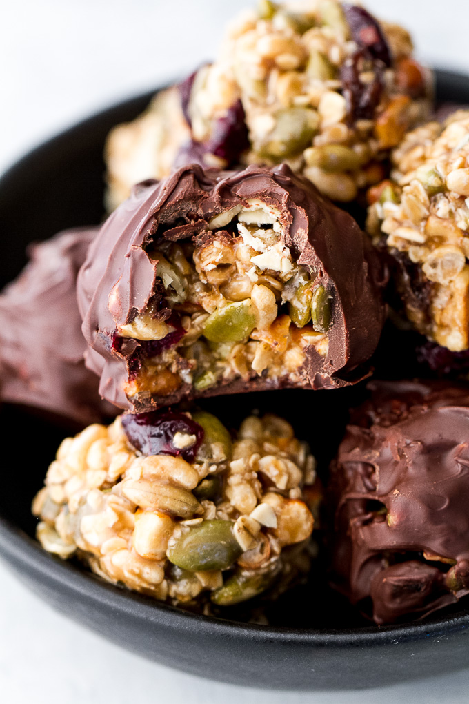 Sweet, salty, chewy, and crisp, these no-bake trail mix bites are sure to satisfy any craving! Gluten-free, nut-free, and vegan, they’re a healthy snack that anyone can enjoy! | runningwithspoons.com