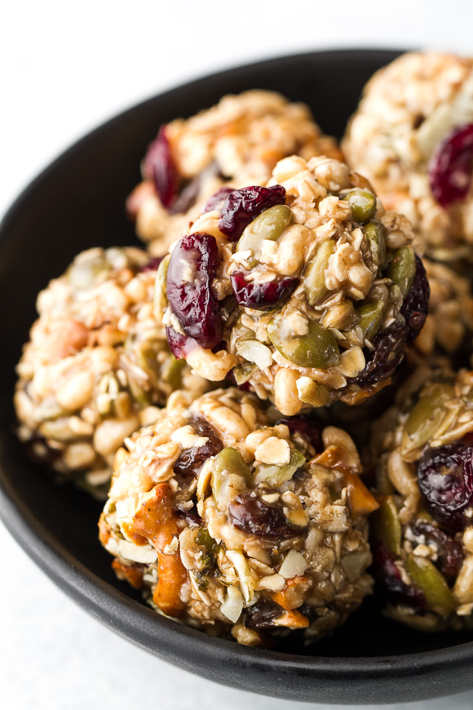 Sweet, salty, chewy, and crisp, these no-bake trail mix bites are sure to satisfy any craving! Gluten-free, nut-free, and vegan, they’re a healthy snack that anyone can enjoy! | runningwithspoons.com