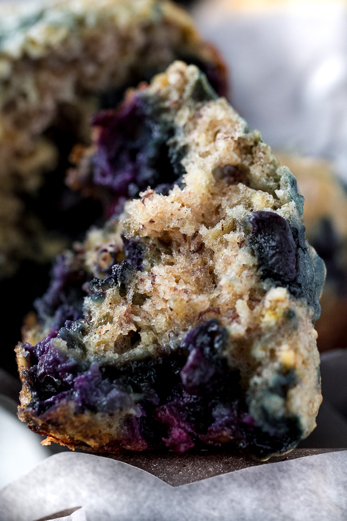 These blueberry banana oatmeal muffins are made with NO butter or oil, but so soft and tender that you'd never be able to tell! Super easy to whip up in only ONE BOWL, they make a deliciously healthy breakfast or snack. | runningwithspoons.com