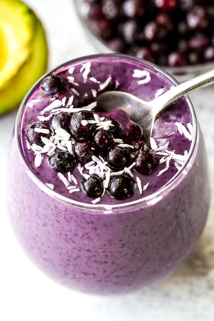 This super creamy blueberry avocado smoothie is packed with protein, healthy fats, vitamins and antioxidants. Gluten-free and easily made vegan, it makes a healthy and delicious breakfast or snack | runningwithspoons.com