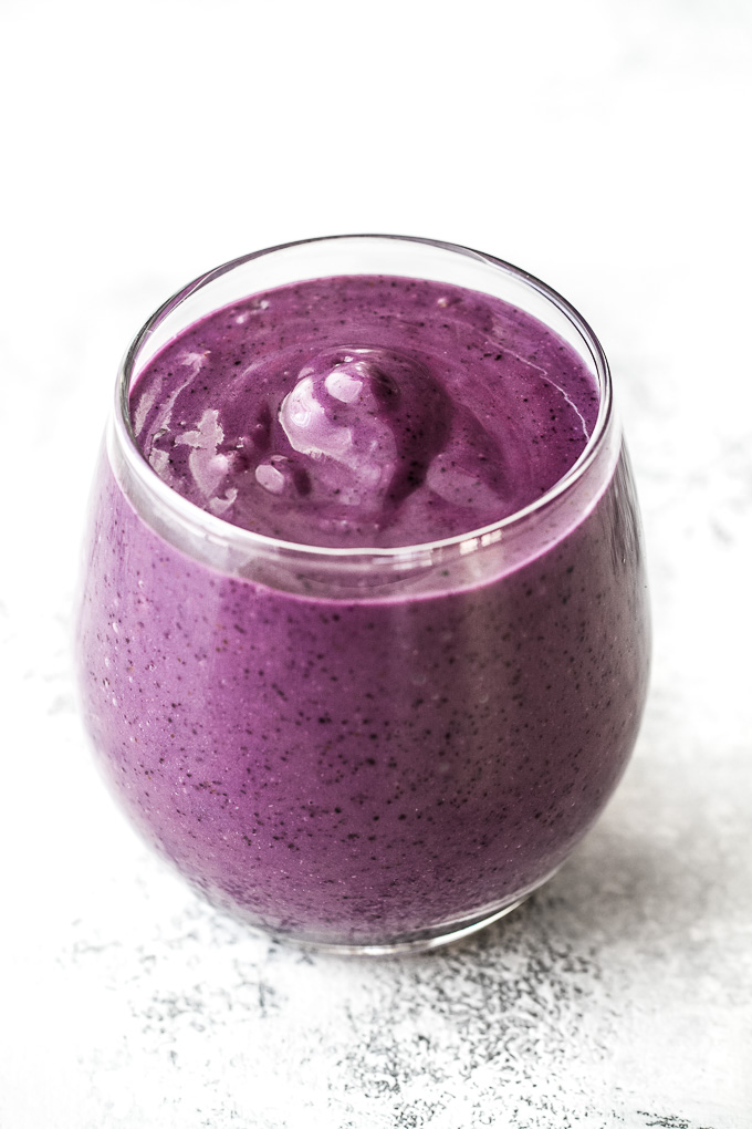This super creamy blueberry avocado smoothie is packed with protein, healthy fats, vitamins and antioxidants. Gluten-free and easily made vegan, it makes a healthy and delicious breakfast or snack | runningwithspoons.com