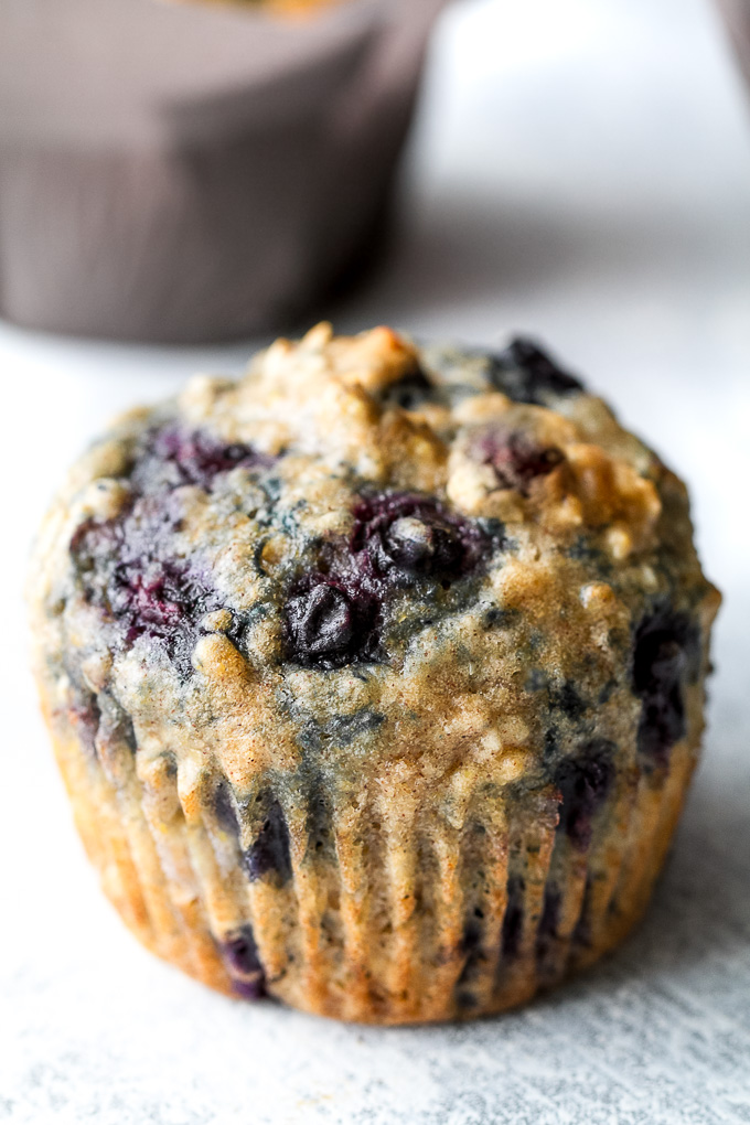 Maple Flax Blueberry Oatmeal Muffins - naturally sweetened and loaded with wholesome ingredients for a deliciously healthy breakfast or snack! | runningwithspoons.com