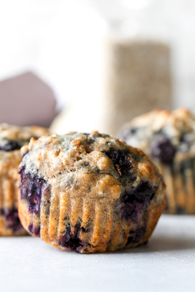 Maple Flax Blueberry Oatmeal Muffins - naturally sweetened and loaded with wholesome ingredients for a deliciously healthy breakfast or snack! | runningwithspoons.com