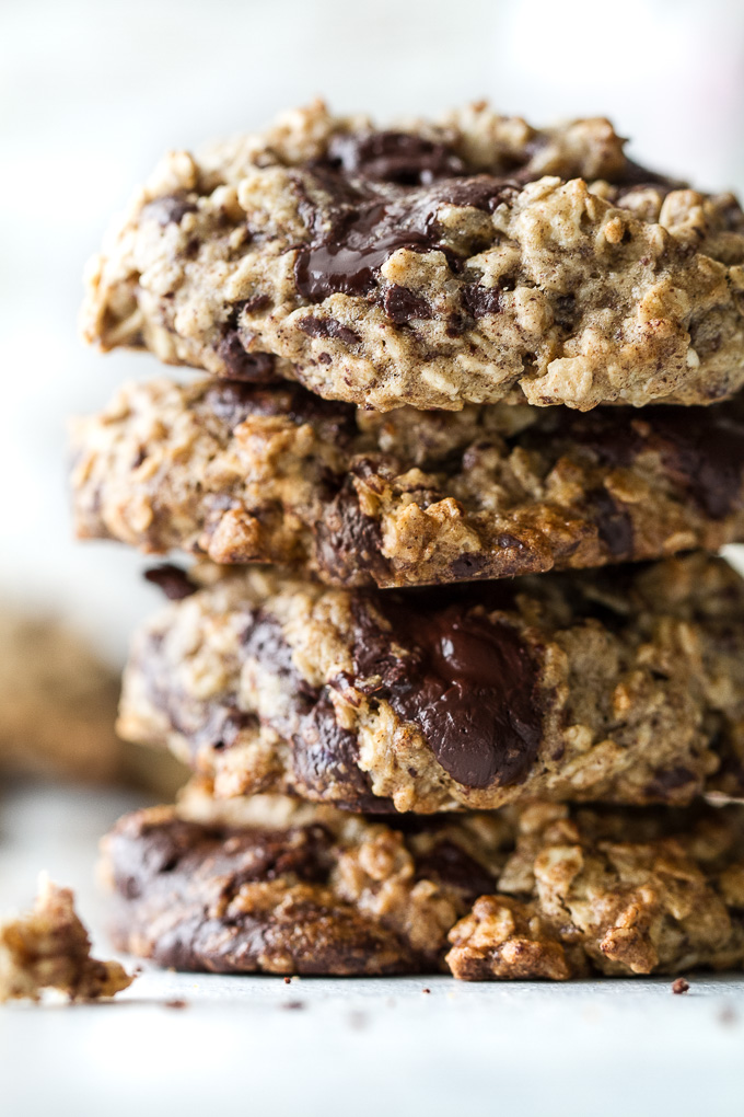 Chocolate chip banana oatmeal cookies made with healthy ingredients and loaded with plenty of chocolate and oats! They're gluten-free, vegan, and make a perfect snack for any time of the day! | runningwithspoons.com