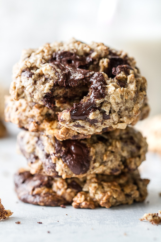 Chocolate chip banana oatmeal cookies made with healthy ingredients and loaded with plenty of chocolate and oats! They're gluten-free, vegan, and make a perfect snack for any time of the day! | runningwithspoons.com