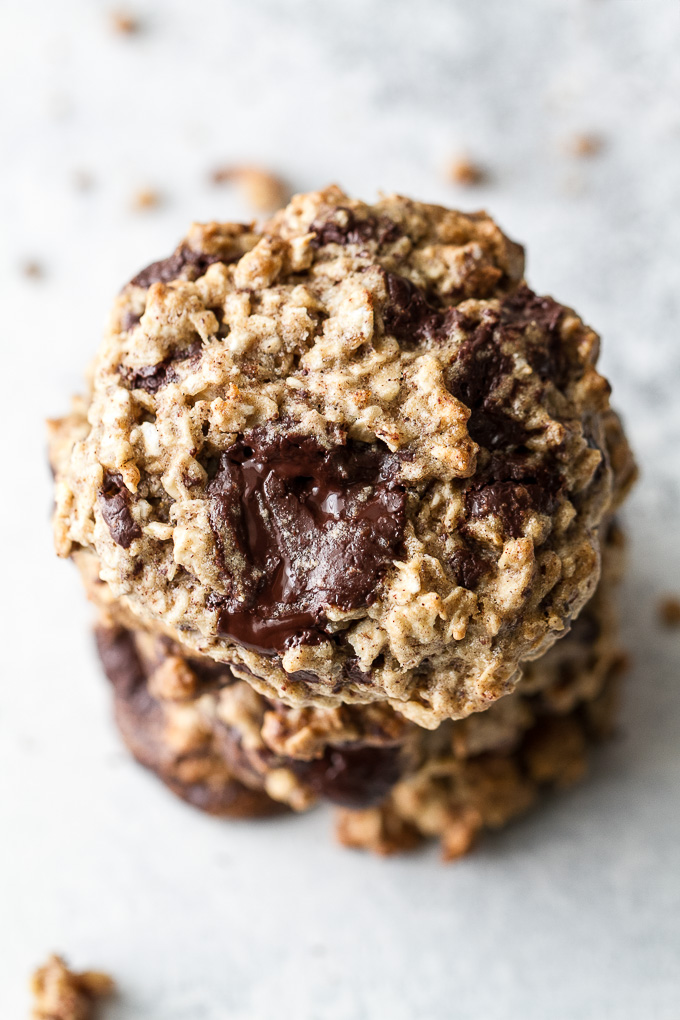 Chocolate chip banana oatmeal cookies made with healthy ingredients and loaded with plenty of chocolate and oats! They're gluten-free, vegan, and make a perfect snack for any time of the day! | runningwithspoons.com