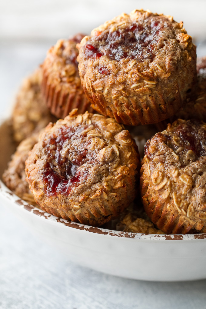 These Almond Butter and Jelly Baked Oatmeal Cups are gluten-free, refined sugar-free, super easy to make, and pack almost 6g of protein! A perfect breakfast or snack. | runningwithspoons.com