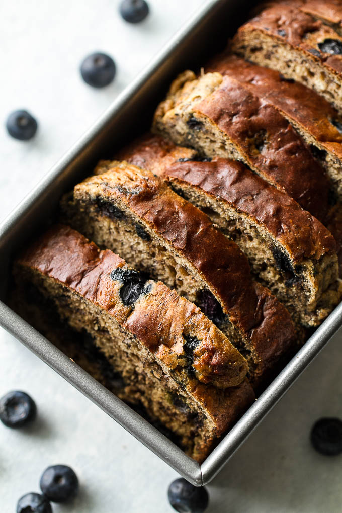 This one bowl Greek Yogurt Blueberry Banana Bread is made without butter or oil, but so tender and flavourful that you’d never be able to tell! Naturally sweetened and bursting with blueberry flavour, it makes a delicious healthier alternative to a traditional favourite!  | runningwithspoons.com