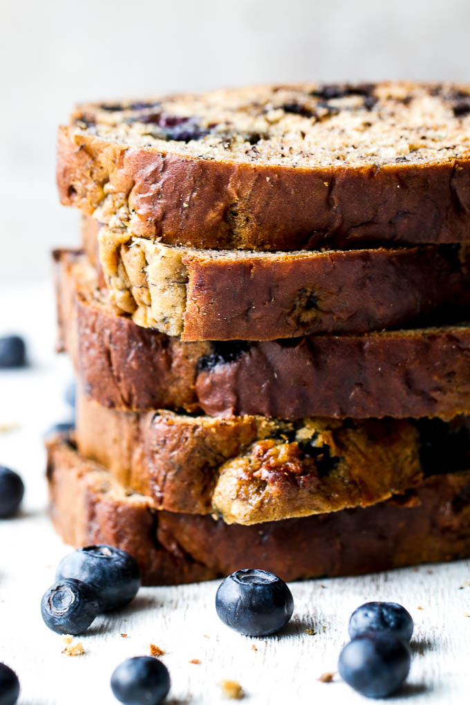 This one bowl Greek Yogurt Blueberry Banana Bread is made without butter or oil, but so tender and flavourful that you’d never be able to tell! Naturally sweetened and bursting with blueberry flavour, it makes a delicious healthier alternative to a traditional favourite!  | runningwithspoons.com