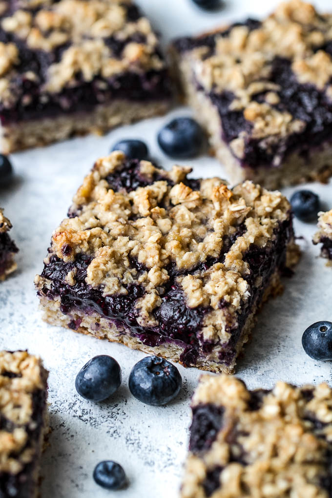 Blueberry Banana Oat Bars - you'd never believe that these soft and chewy bars are vegan, gluten-free, refined sugar-free, and made without any butter or oil! The perfect healthy breakfast or snack! | runningwithspoons.com