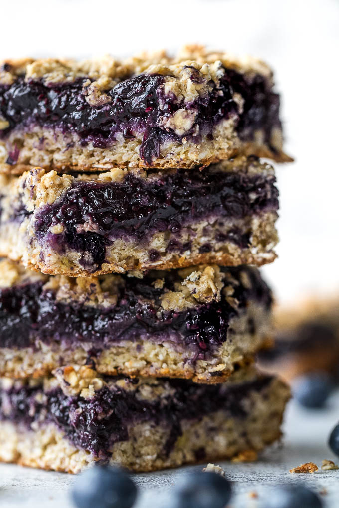 Blueberry Banana Oat Bars - you'd never believe that these soft and chewy bars are vegan, gluten-free, refined sugar-free, and made without any butter or oil! The perfect healthy breakfast or snack! | runningwithspoons.com