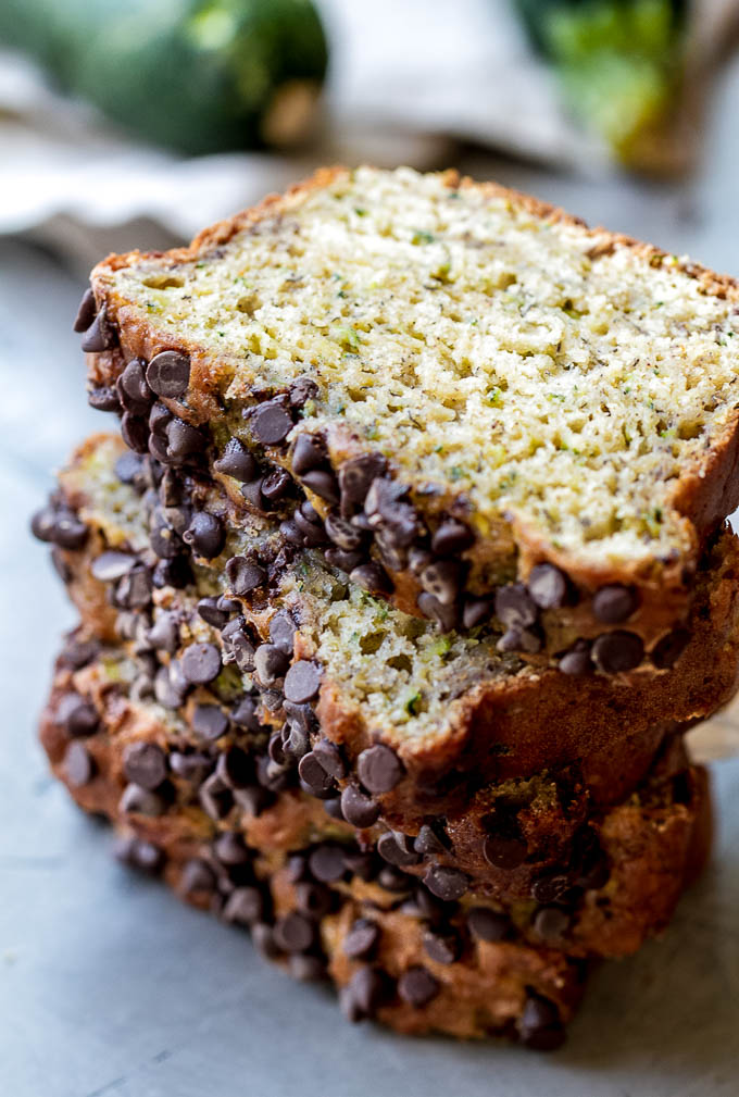 One Bowl Zucchini Banana Bread - made without butter or oil, but so tender and flavourful that you’d never be able to tell it's healthy! Greek yogurt, bananas, and shredded zucchini keep it extra moist, while a sprinkle of chocolate chips make it feel extra decadent | runningwithspoons.com