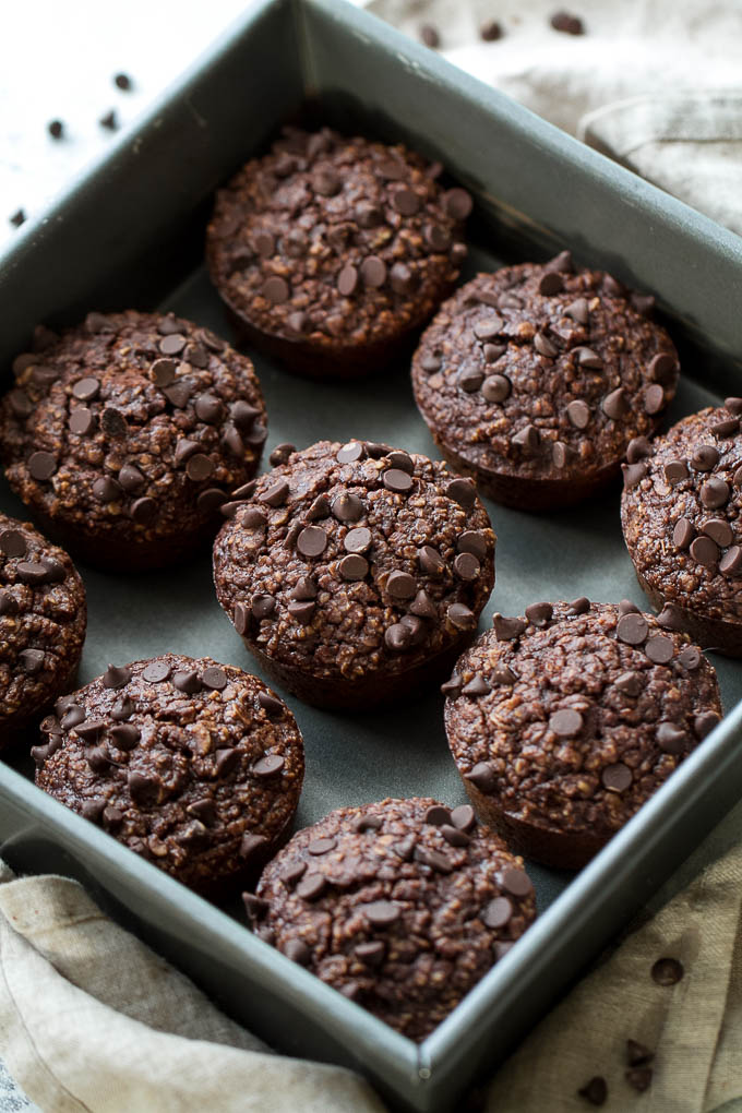 Brownie Batter Breakfast Muffins that are naturally sweetened and loaded with chocolate flavour! They're a deliciously healthy way to start your day or pull out whenever you need a satisfying snack | runningwithspoons.com