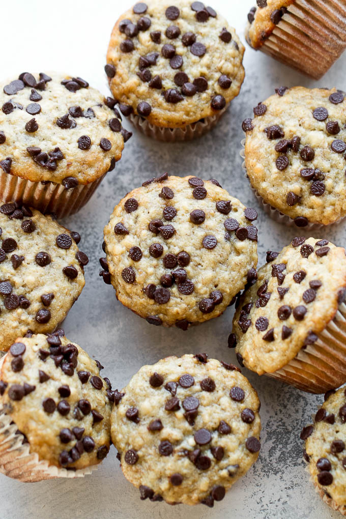 One Bowl Chocolate Chip Banana Oat Muffins - so soft and tender that you'd never guess they're made without butter or oil. Deliciously healthy and SUPER easy to whip up using just one bowl! | runningwithspoons.com