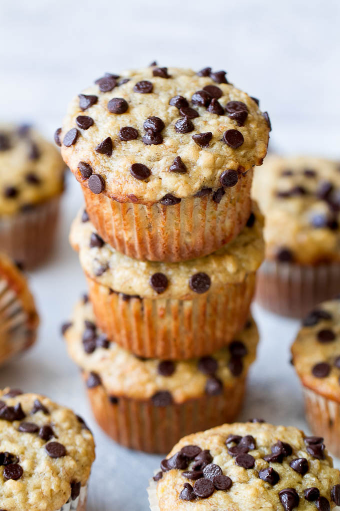 One Bowl Chocolate Chip Banana Oat Muffins - so soft and tender that you'd never guess they're made without butter or oil. Deliciously healthy and SUPER easy to whip up using just one bowl! | runningwithspoons.com