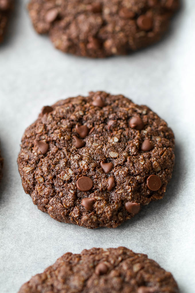 Flourless double chocolate oatmeal cookies that are soft, chewy, loaded with chocolate, and super easy to make with only one bowl and a handful of simple ingredients! They're gluten-free and a perfect choice for when those chocolate cravings hit | runningwithspoons.com
