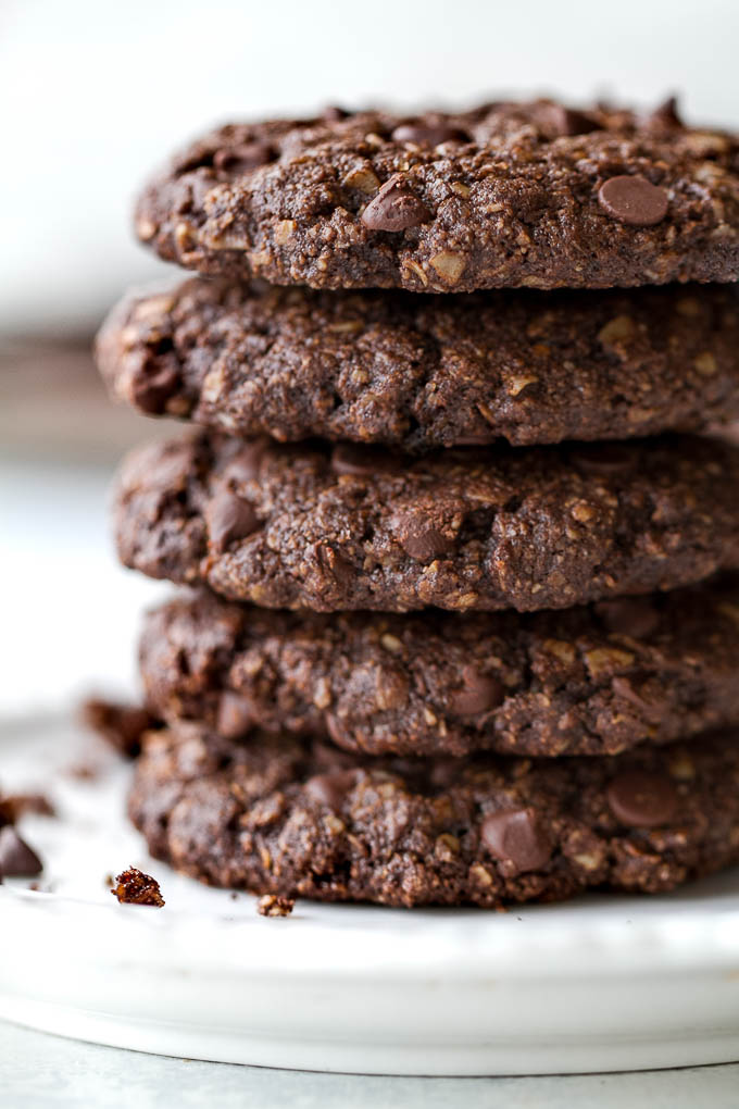 Flourless double chocolate oatmeal cookies that are soft, chewy, loaded with chocolate, and super easy to make with only one bowl and a handful of simple ingredients! They're gluten-free and a perfect choice for when those chocolate cravings hit | runningwithspoons.com