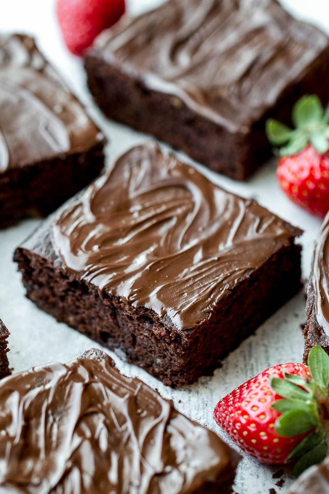 Flourless Strawberry Brownies made in one bowl with super simple ingredients! They’re grain-free, oil-free, and refined-sugar-free, so they make a deliciously healthy gluten-free and paleo treat for when those chocolate cravings hit | runningwithspoons.com