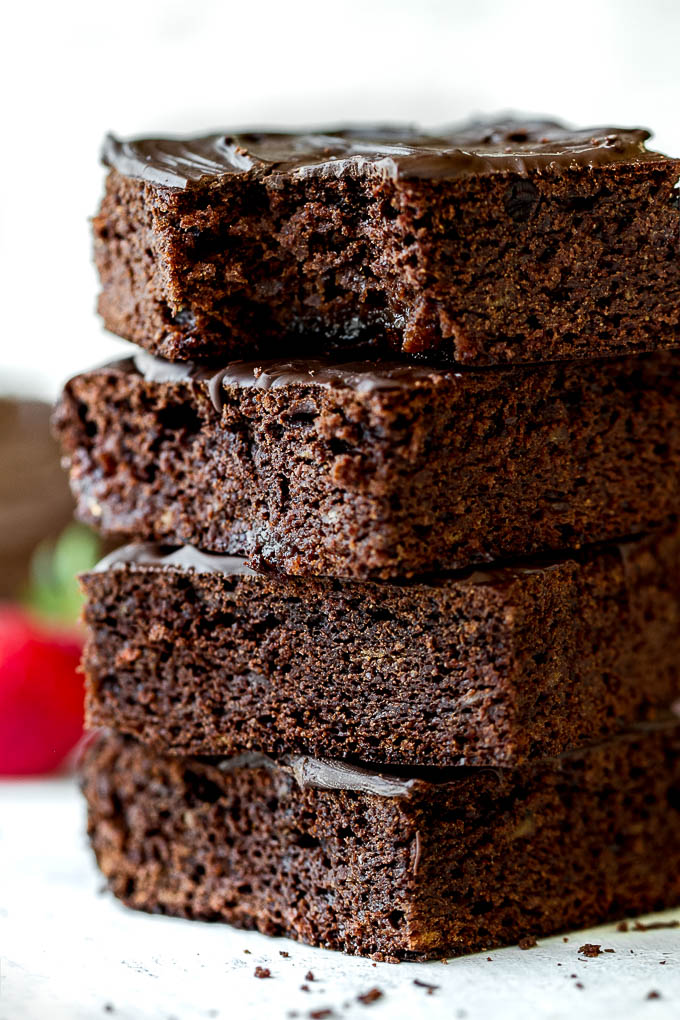 Flourless Strawberry Brownies made in one bowl with super simple ingredients! They’re grain-free, oil-free, and refined-sugar-free, so they make a deliciously healthy gluten-free and paleo treat for when those chocolate cravings hit | runningwithspoons.com