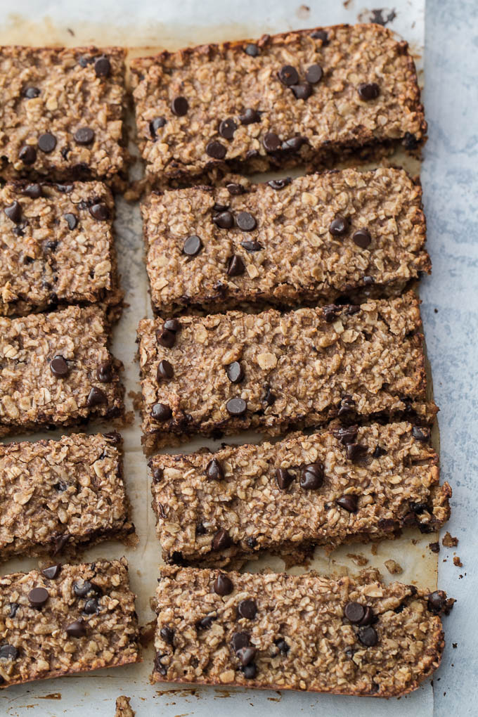 So much better than store-bought! These honey almond granola bars are made without any refined sugars or oils, with just the perfect touch of honey and almond flavour! They’re gluten-free, vegan, and easily made nut-free if you need them to be. The perfect easy and healthy snack! | runningwithspoons.com