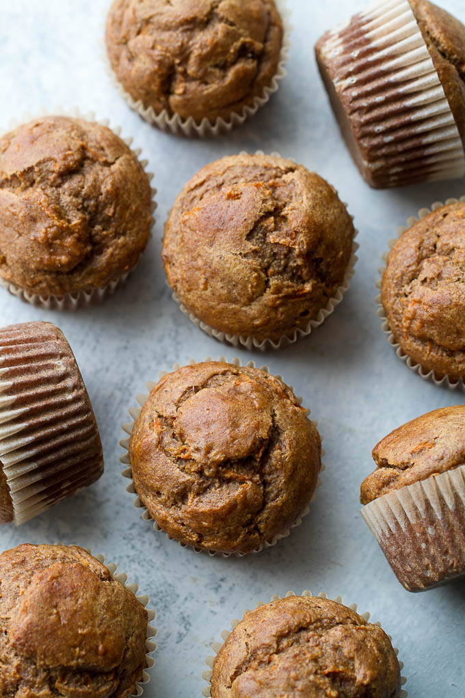 Flourless banana carrot muffins that are so tender and flavourful, you’d never know they were made without flour, oil, or refined sugar. Gluten free and made with wholesome ingredients, they make a healthy and delicious breakfast or snack | runningwithspoons.com #glutenfree #healthy #recipe