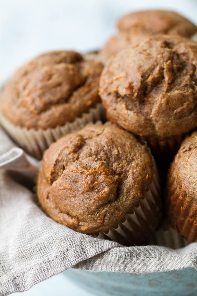 Flourless banana carrot muffins that are so tender and flavourful, you’d never know they were made without flour, oil, or refined sugar. Gluten free and made with wholesome ingredients, they make a healthy and delicious breakfast or snack | runningwithspoons.com #glutenfree #healthy #recipe