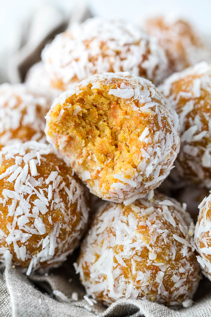 These Grain Free Carrot Cake Bites are paleo, vegan, refined sugar-free, and made with only 4 major ingredients! They're soft and doughy with a subtle sweetness and the perfect amount of spice. A perfect little healthy snack. | runningwithspoons.com #vegan #paleo #spring #glutenfree 