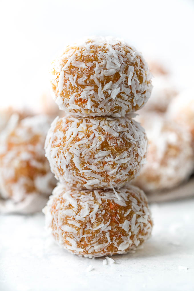 These Grain Free Carrot Cake Bites are paleo, vegan, refined sugar-free, and made with only 4 major ingredients! They're soft and doughy with a subtle sweetness and the perfect amount of spice. A perfect little healthy snack. | runningwithspoons.com #vegan #paleo #spring #glutenfree