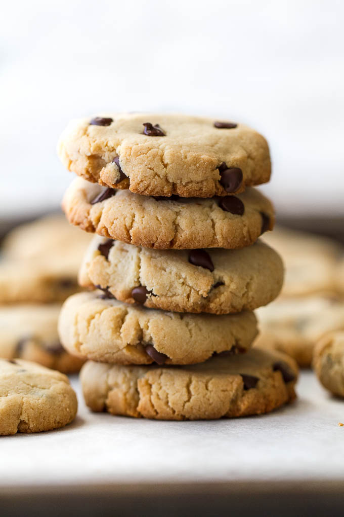 These Grain Free Vegan Chocolate Chip Cookies have the same texture and taste as a classic chocolate chip cookie, but are made without flour, butter, eggs, or refined sugar! | runningwithspoons.com #paleo #vegan #glutenfree #recipe