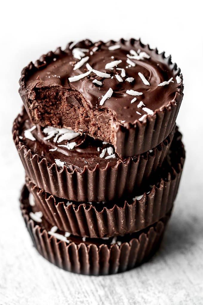 No Bake Protein Brownie Cups with a soft and fudgy brownie center surrounded by a thin crisp layer of chocolate. They're grain-free, gluten-free, and easily made vegan, and/or paleo. A healthy and delicious way to satisfy those chocolate cravings! | runningwithspoons.com #dessert #recipe #chocolate