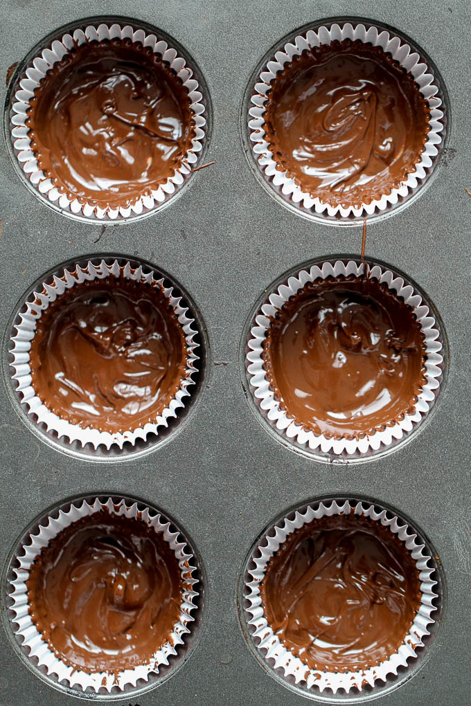 No Bake Protein Brownie Cups with a soft and fudgy brownie center surrounded by a thin crisp layer of chocolate. They're grain-free, gluten-free, and easily made vegan, and/or paleo. A healthy and delicious way to satisfy those chocolate cravings! | runningwithspoons.com #dessert #recipe #chocolate
