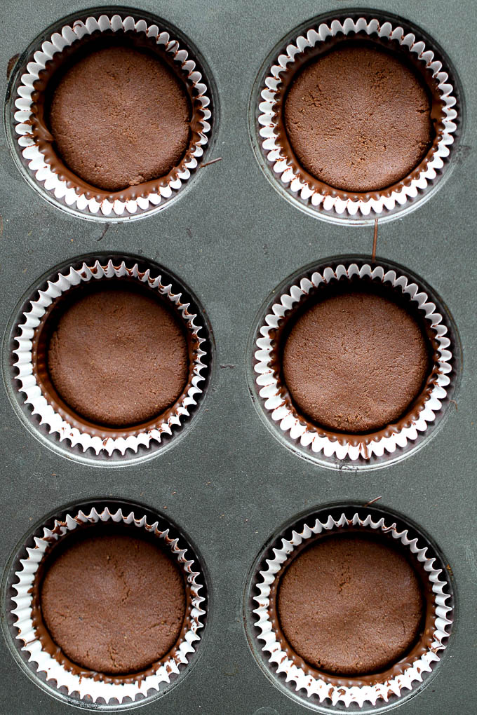 No Bake Protein Brownie Cups with a soft and fudgy brownie center surrounded by a thin crisp layer of chocolate. They're grain-free, gluten-free, and easily made vegan, and/or paleo. A healthy and delicious way to satisfy those chocolate cravings! | runningwithspoons.com #dessert #recipe #chocolate