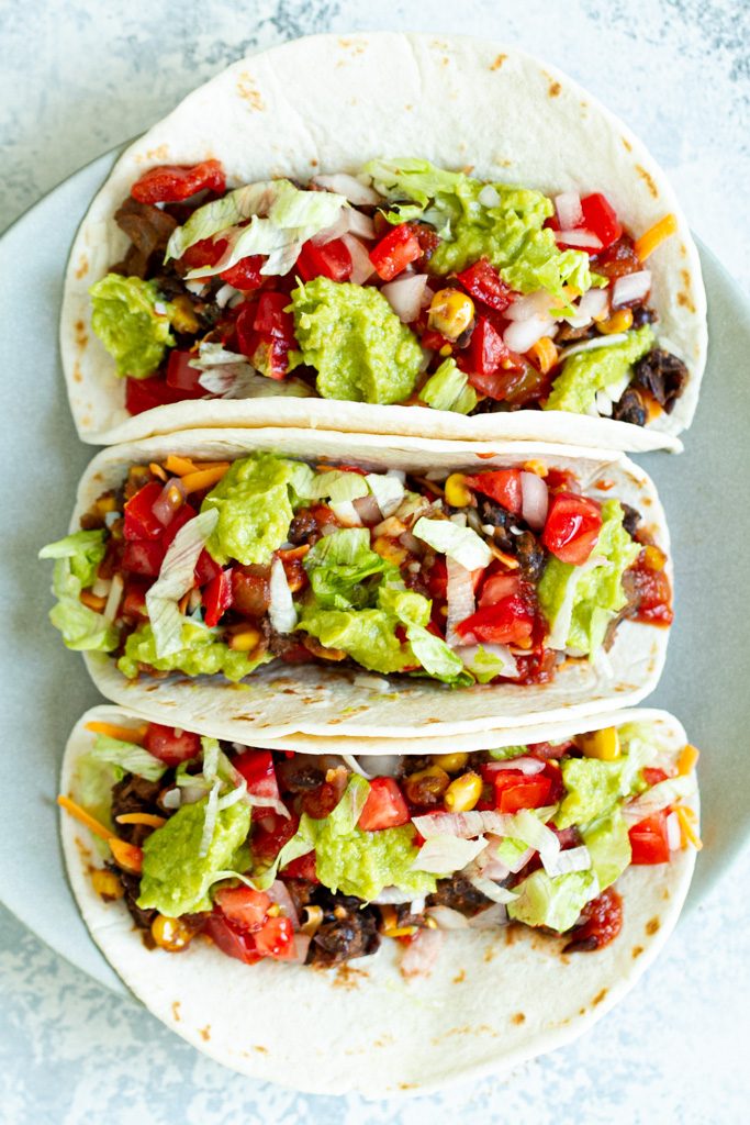 A quick and easy black bean taco filling that even meat eaters will love! Loaded with flavour and plant-based protein, it makes a perfect vegan option for your next taco night!