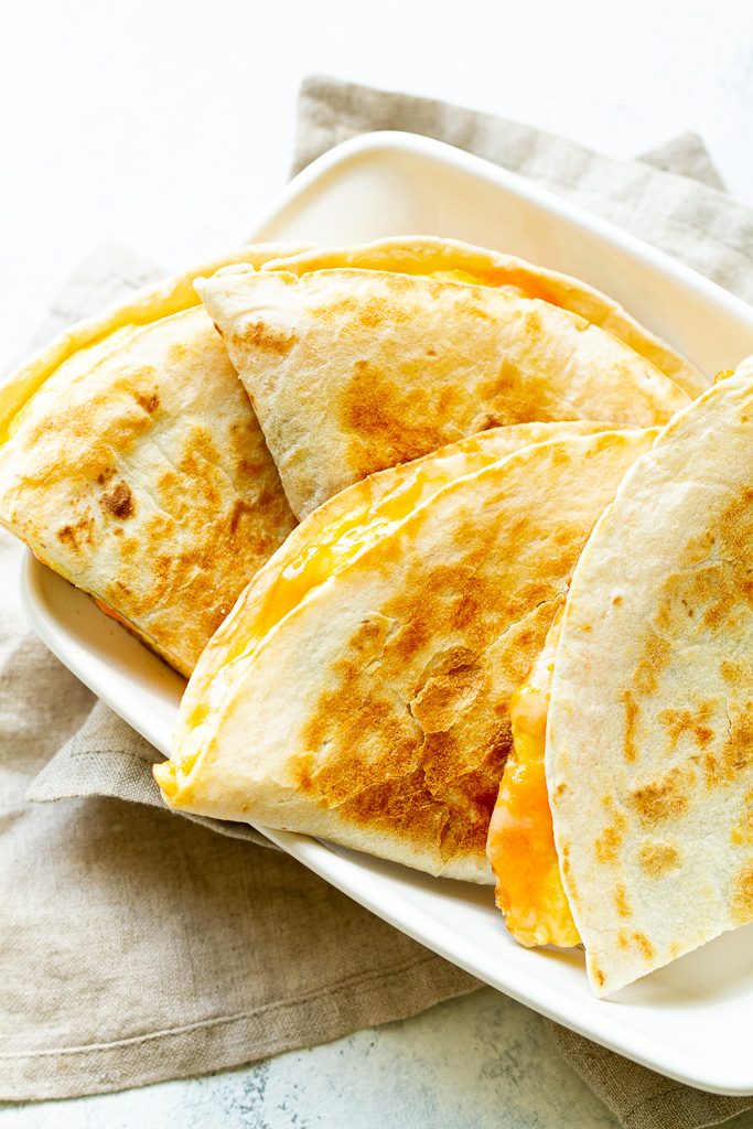 Breakfast quesadillas on a plate.